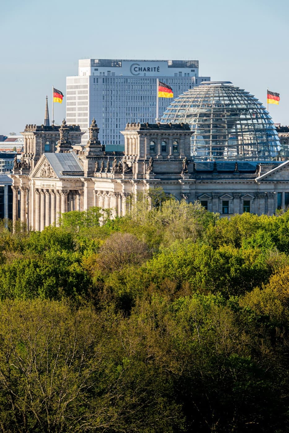 The Reichstag's glass dome in Berlin, with the Charité hospital tower behind it